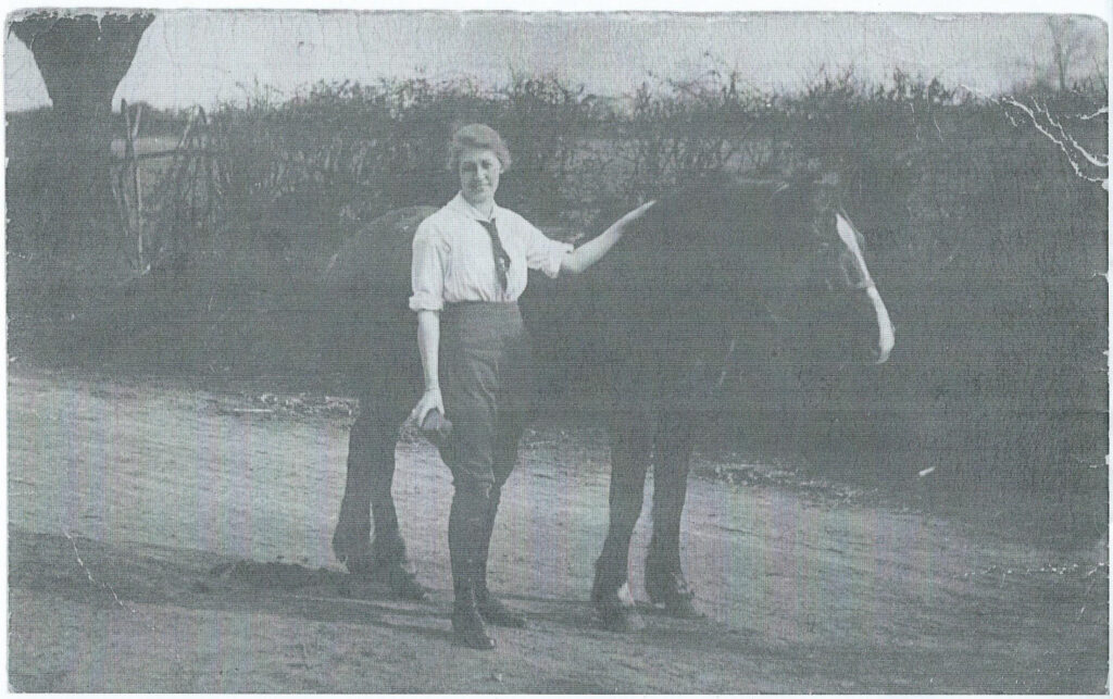 Land girl Dorothy Brown, The Grange, Gunthorpe, Peterborough c1916 grooming horse