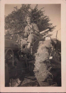 Joan Birchall (married name Lynn) on tractor