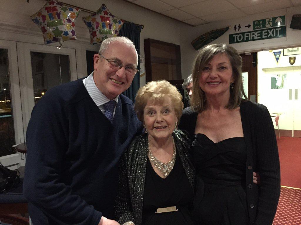 Zeita Holes celebrating her 90th birthday in March 2015, together with Stuart Antrobus, who researched the history of the WLA in Bedfordshire, and her daughter, Pauline Robins, who had come over to Bedford with her family and grandchildren, from her home in California.