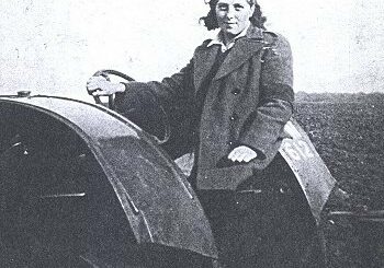 Unknown Land Girl on a tractor.