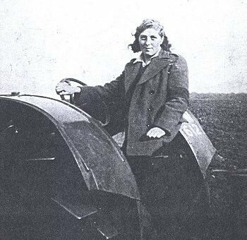 Unknown Land Girl on a tractor.