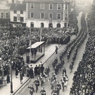 Bedfordshire land girls march past Princess Elizabeth down Bedford High Street on 14 February 1946 in a Victory parade