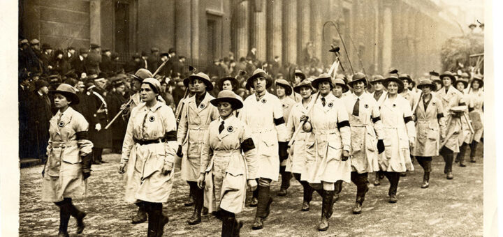 The march of the Land Girls in the Lord Mayor's Show. A company of members of the WLA, in white smocks, with a wagon containing weather-browned and smiling women workers, formed a picturesque feature of the show. Source: Catherine Procter Collection