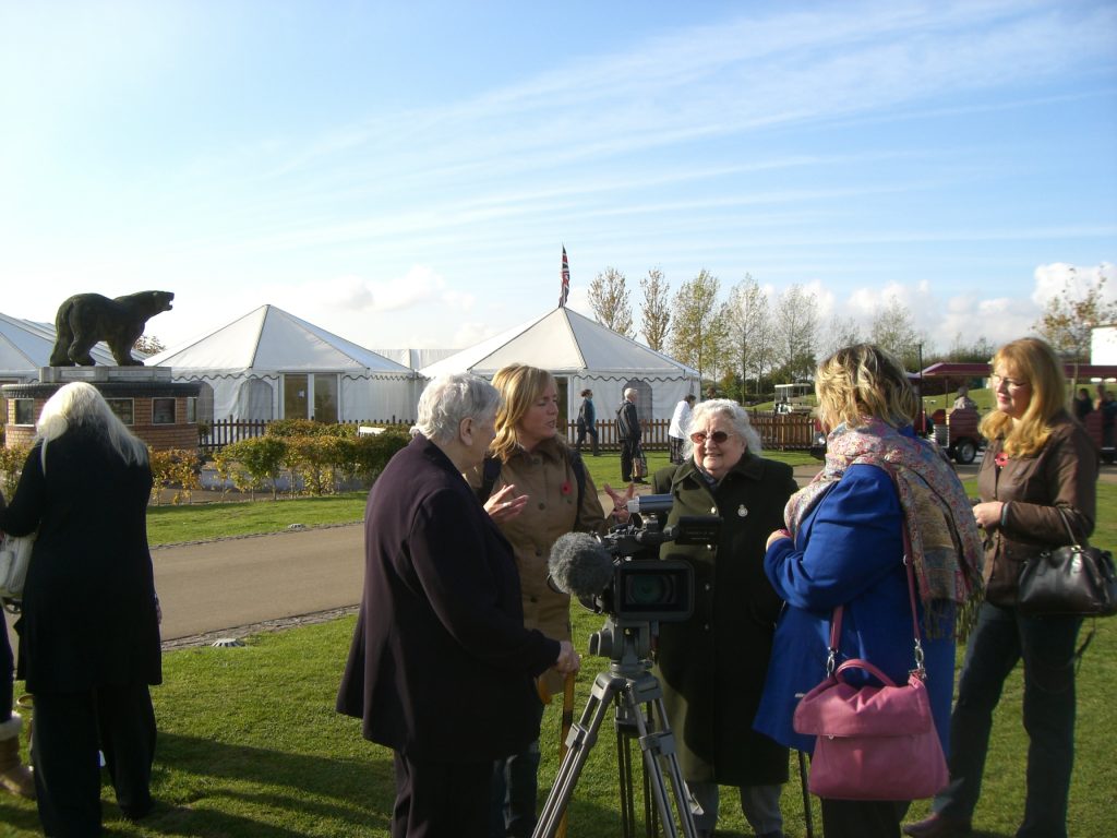 Mary Malpass being interviewed at the unveiling of the WLA and WTC memorial at the National Memorial Arboretum in October 2014