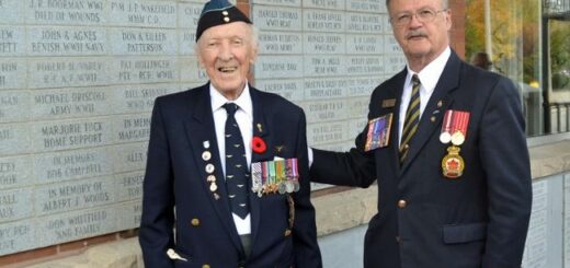 Fred Davies, left, looks on at Branch 34 president Rick Purcell unveils a paver Davies had placed in memory of Gladys Lillicrap.