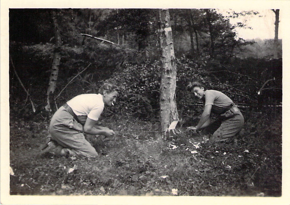 Using the cross-cut saw. Spenny and another woman.