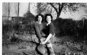 Lottie and Kath sat on a log