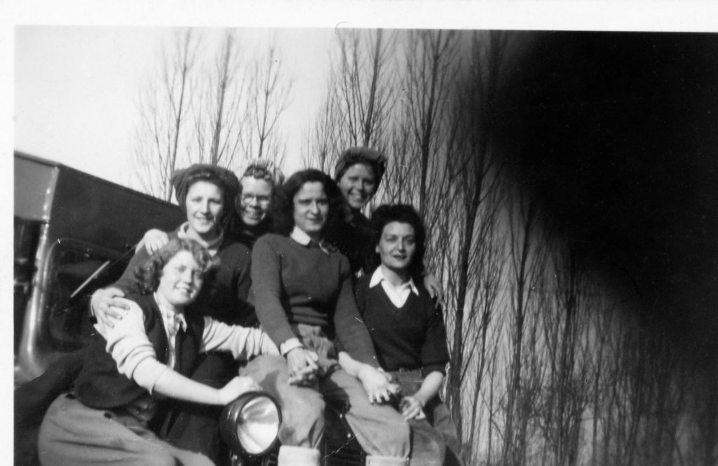 Sat on front of lorry, from left to right Joan Clingham, Doris (Cockney), Lottie, ?, Violet Budd, Kay