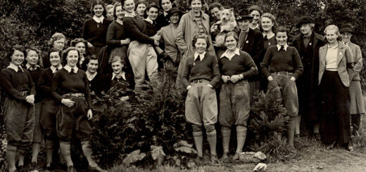 A group of smiling Land Girls.