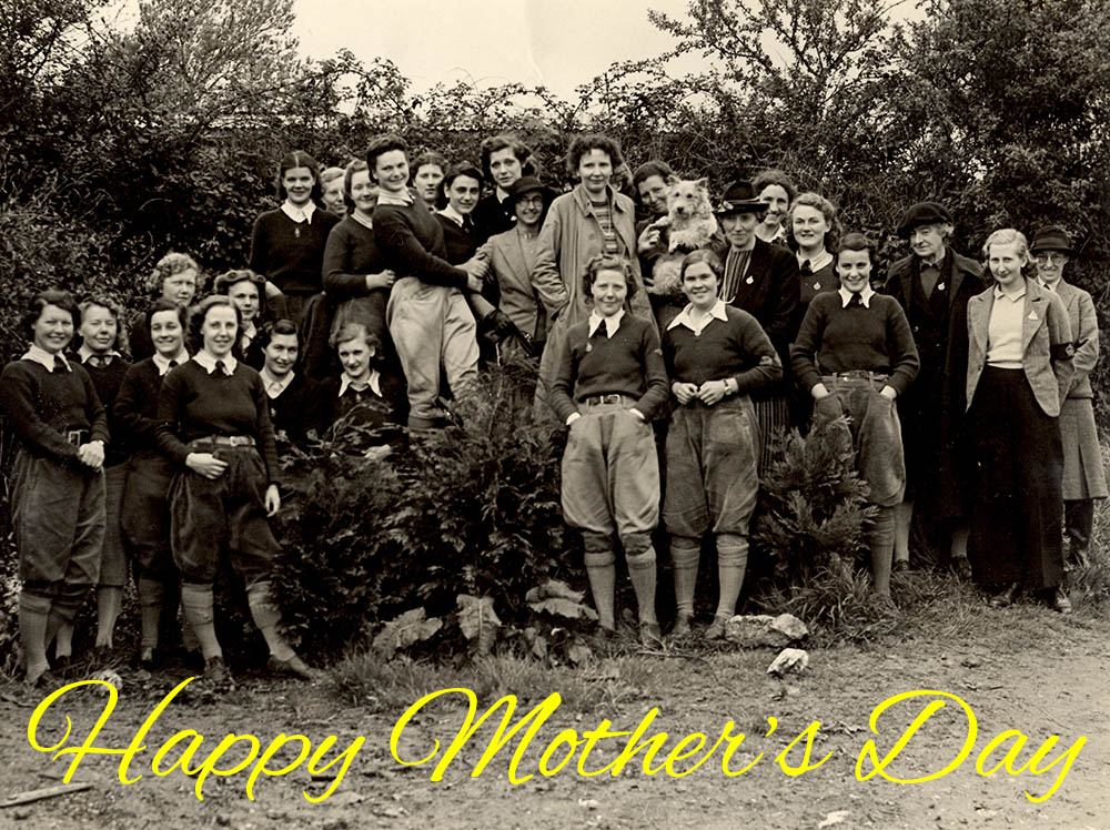 A group of smiling Land Girls.