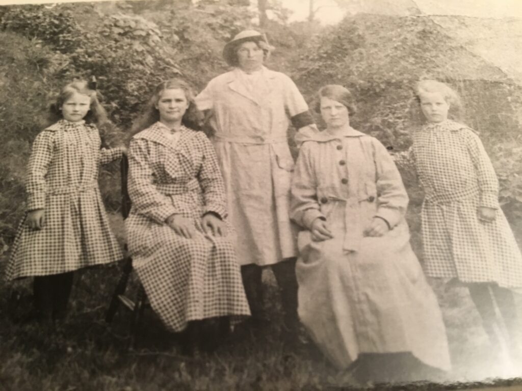 Catherine Jane Evans in her WLA uniform with her sisters.