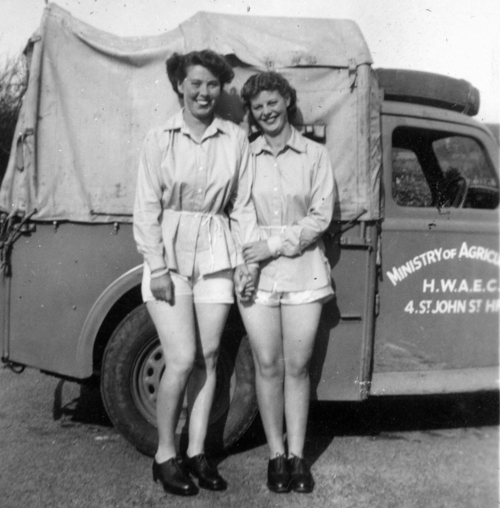 Land Girls in Weobley in front of a Ministry of Agriculture lorry