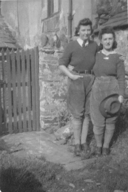 Gwyneth Mary Edwards (left standing) with her friend Megan (standing right).