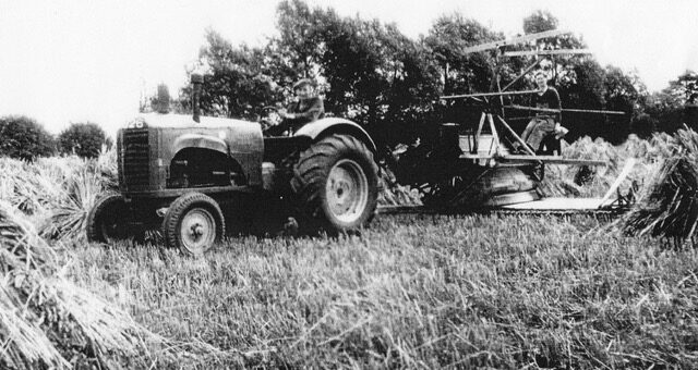 Emma Chapman working reaper-binder at Walnut Farm, Newport Pagnell, August 1941