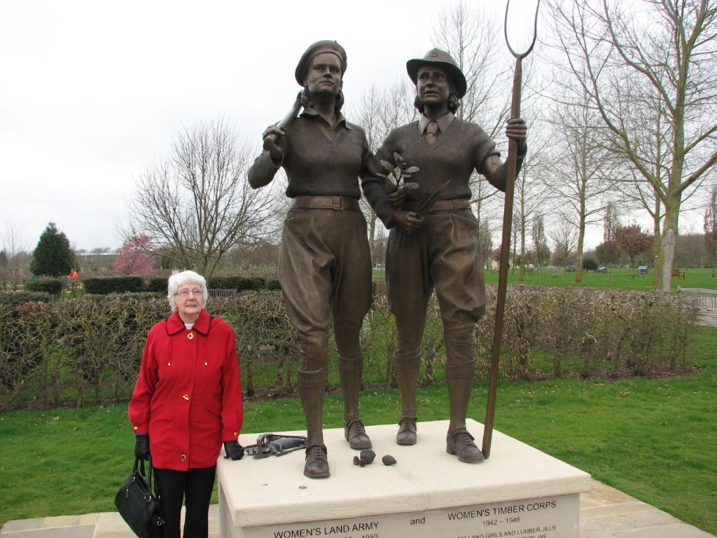 Mary Whalley (née Hancock) standing next to WLA and WTC memorial at NMA