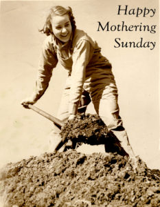 A photograph of a Land Girl digging