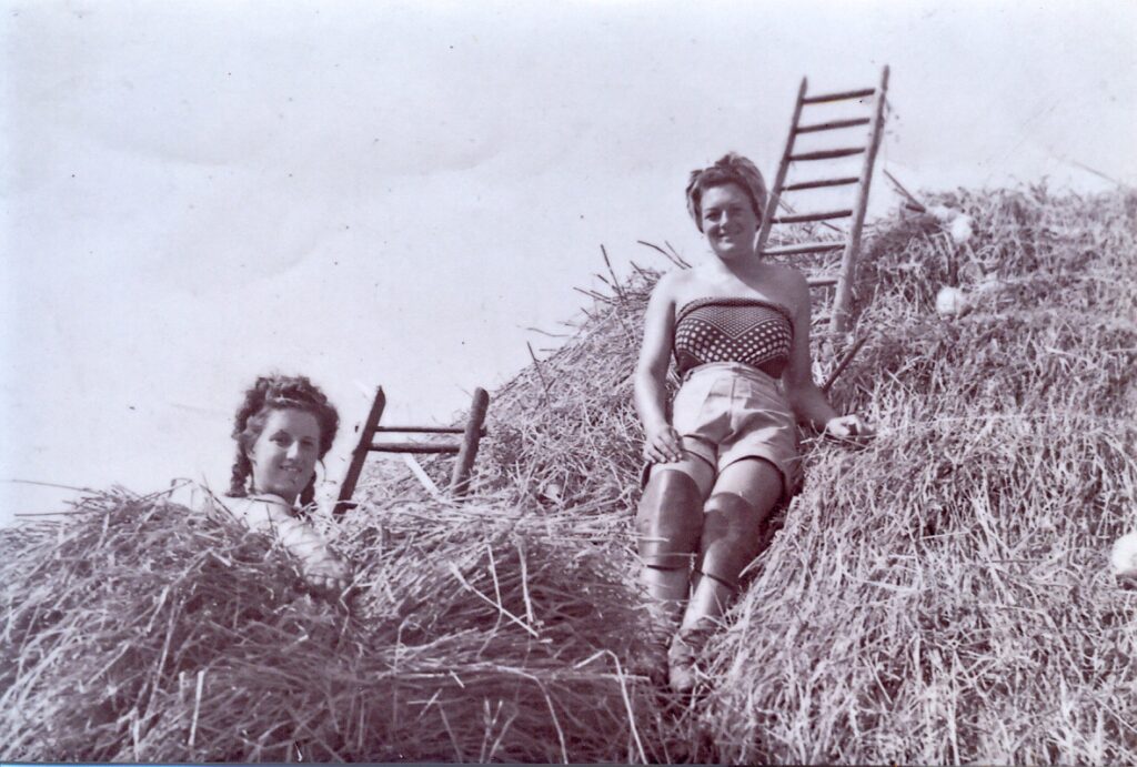 Gwendoline Ragget nee Place thatching on roof