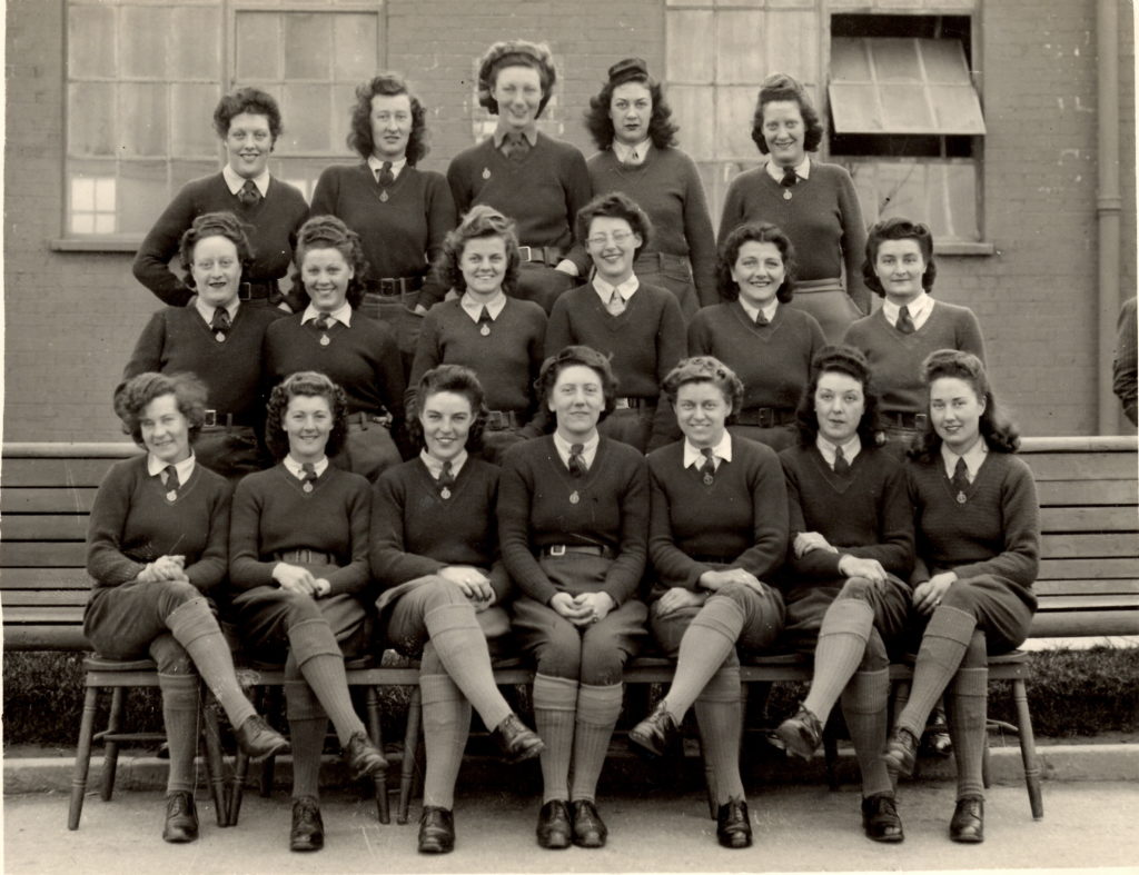 Land Girls sitting outside a hostel