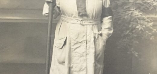 A First World War Land Girl holding a pitchfork.